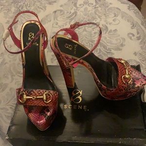 Pink snake print chunky heel platform stilettos.